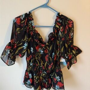 CeCe Black, Red and Blue. Flirty Blouse with Flutter Sleeves and Ruffled Style.
